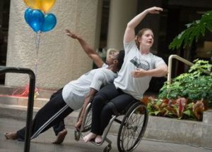 Members of Full Radius Dance Company perform at a Fulton County Disability Awareness Expo celebrating ADA.