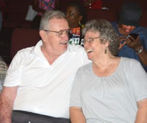 Photo of Bob and Pat Taylor, Rusty’s parents , smiling enjoying the SHOWAbility concert.