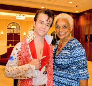 DELVIS (teen singer and Elvis Entity) smiles in photo with SHOWAbility Executive Director Myrna Clayton.