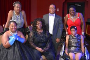 Fashion Designer Sharon Gary-Dill poses with SHOWAbility Board member Norma Stanley and with fashion models on the disability spectrum.