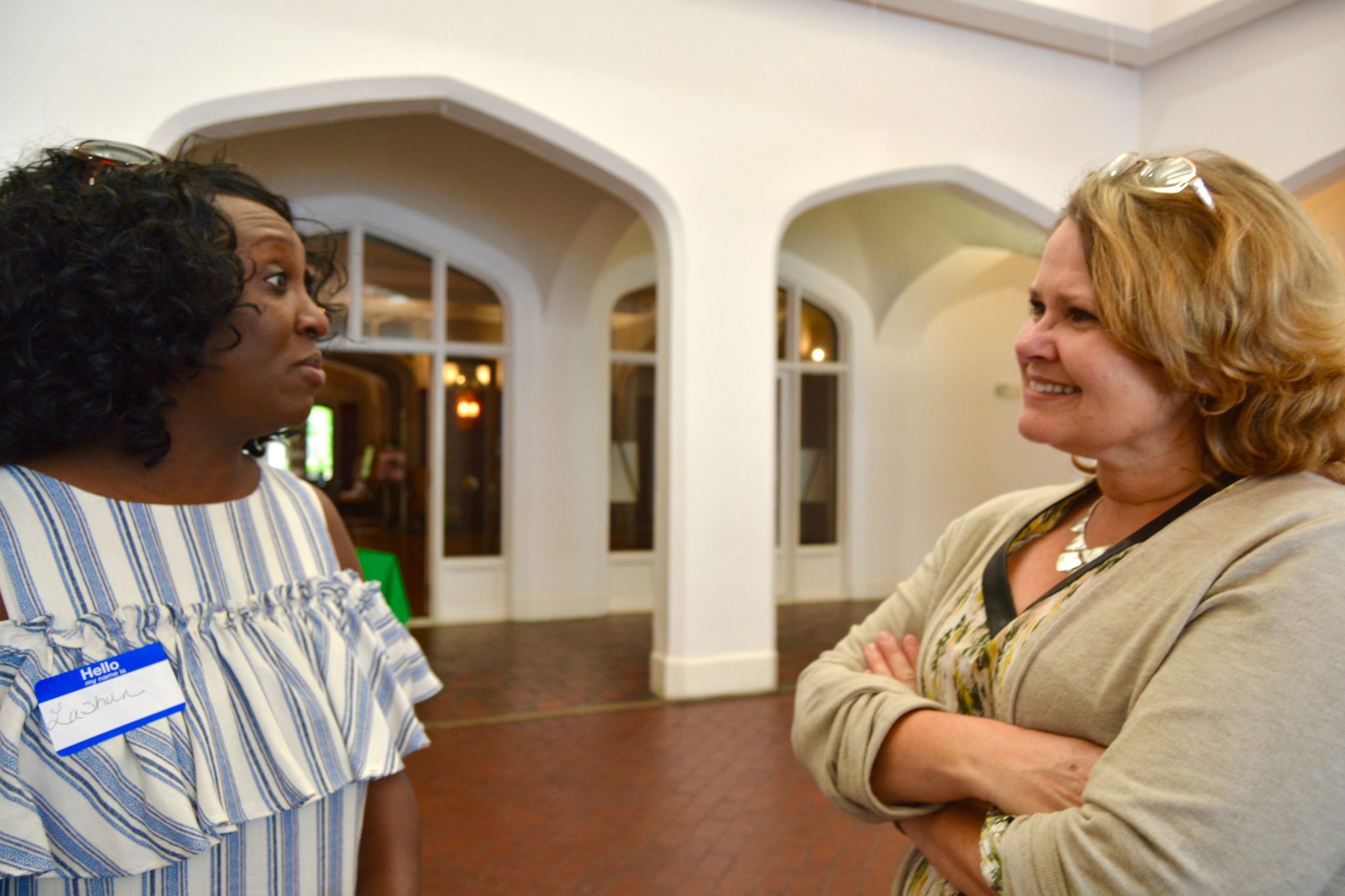 DSC_0423 Two disability advocates talking together at SHOWAbility’s Community Meet & Greet at Callanwolde Fine Arts Center.