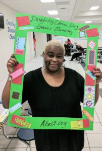 SHOWAbility Board Chair Twanda Black with selfie image picture frame for at the Disability Awareness Career Day.