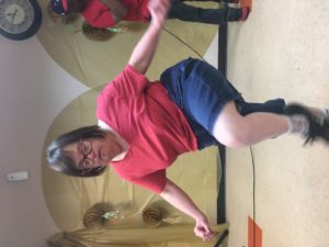 Young adult female with a developmental disability shows her Michael Jackson dance moves